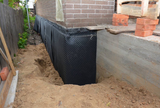 SJ Waterproofing Pros technician performing targeted Waterproofing assessment in Chapel Hill, NC